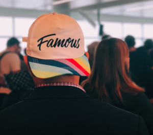 guy with cap, "famous" text on it