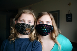 mother and child wearing coronavirus masks