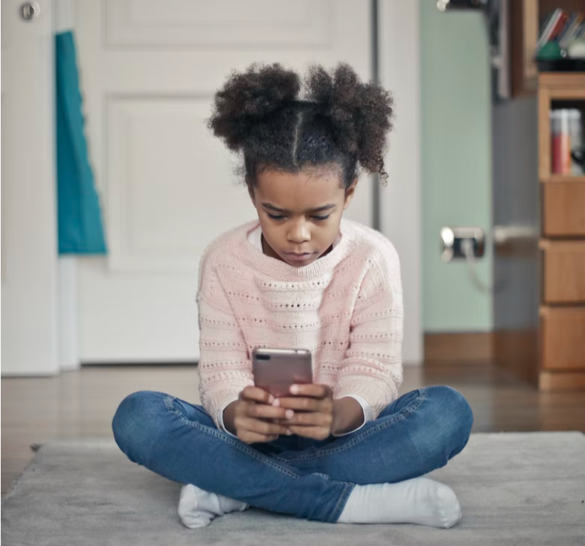 girl making top ups using a smartphone