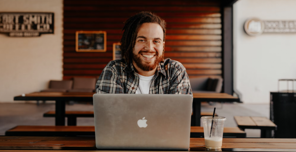 young man in front of a laptop