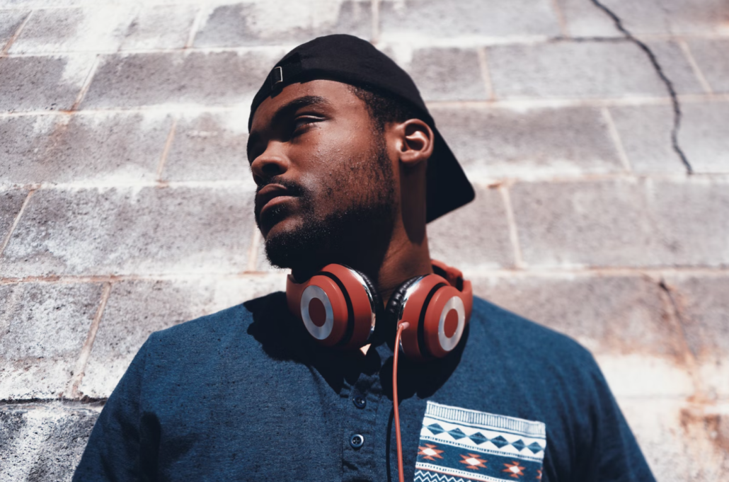 African man listening to Boomplay music