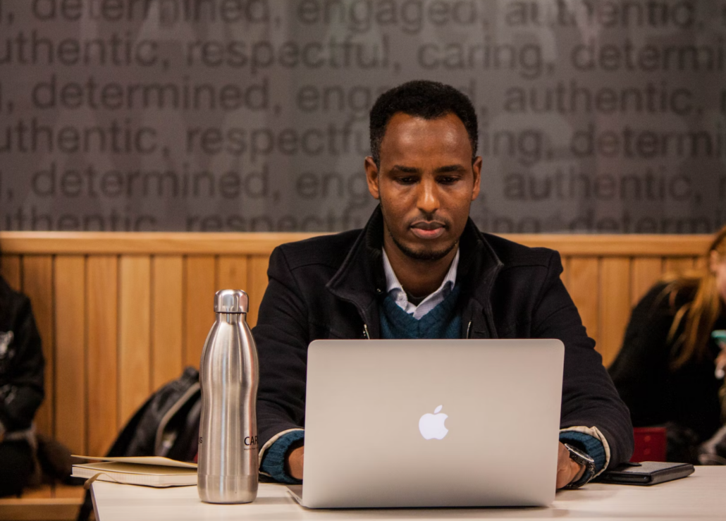 expat in front of his laptop