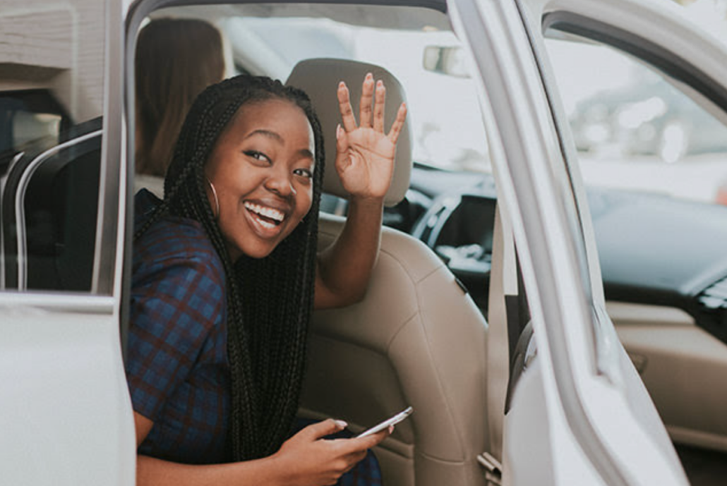 Woman using Uber balalnce gift card from MobileRecharge.com