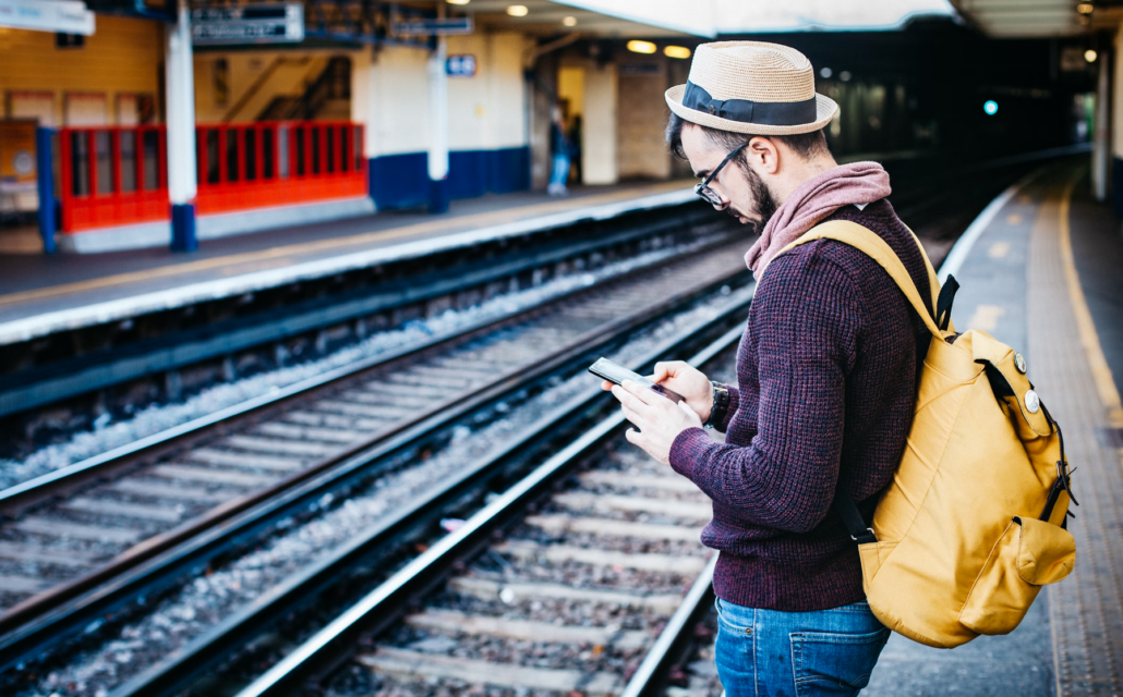 Man using phone while traveling